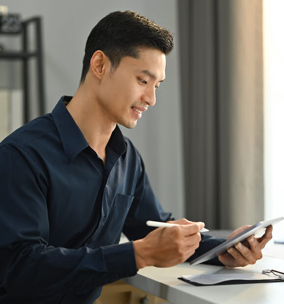 portrait-of-millennial-asian-man-using-digital-tab-2024-11-25-23-05-46-utc (1)
